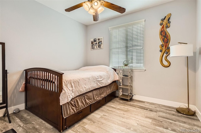 8317 Liverpool Cir, Littleton, CO 80125 - bedroom with wood finished floors, baseboards, and a ceiling fan