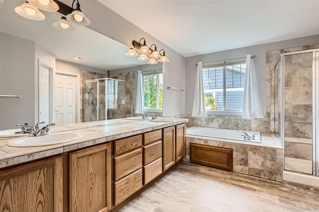 8317 Liverpool Cir, Littleton, CO 80125 - full bath with a stall shower, a garden tub, and double vanity