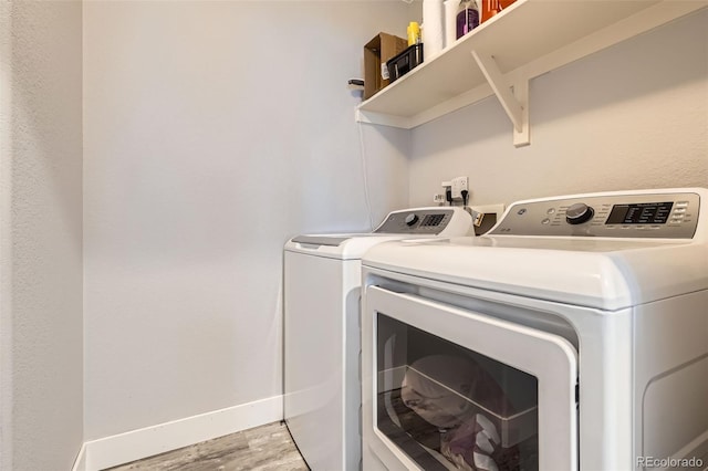 8317 Liverpool Cir, Littleton, CO 80125 - washroom with independent washer and dryer, light wood-style floors, and baseboards