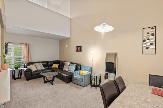 5800 Tower Rd Unit 610, Denver, CO 80249 - living area featuring carpet flooring and a towering ceiling