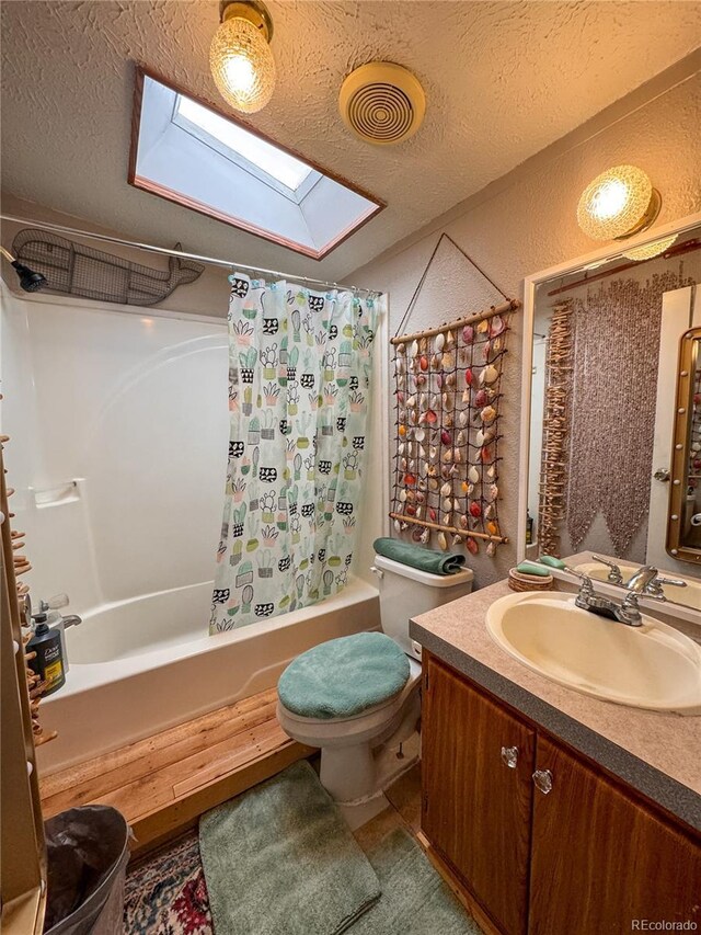 312 Ceratosaurus Cir, Dinosaur, CO 81610 - full bath with visible vents, shower / bath combo, a textured ceiling, a skylight, and vanity