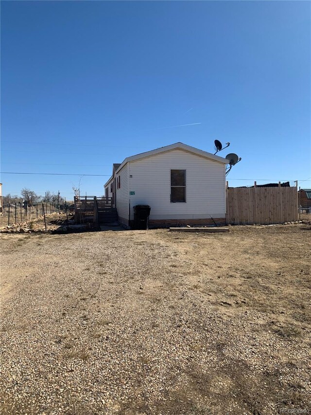 312 Ceratosaurus Cir, Dinosaur, CO 81610 - view of side of property featuring fence