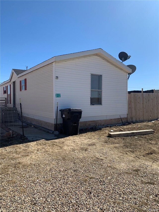 312 Ceratosaurus Cir, Dinosaur, CO 81610 - view of side of home with fence
