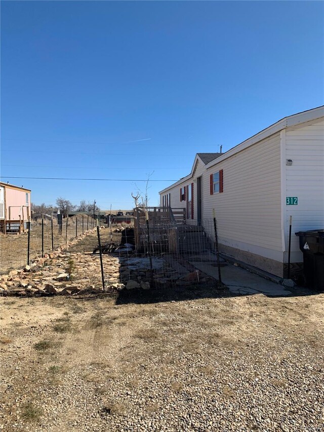 312 Ceratosaurus Cir, Dinosaur, CO 81610 - view of home's exterior featuring fence