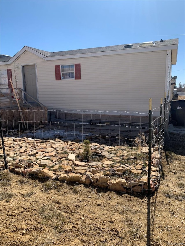312 Ceratosaurus Cir, Dinosaur, CO 81610 - rear view of house featuring fence