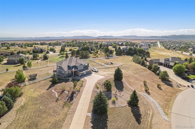 birds eye view of property with a mountain view