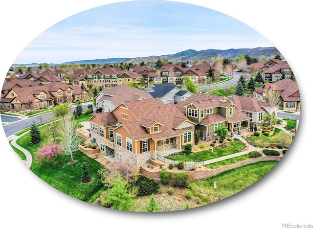 drone / aerial view with a residential view and a mountain view