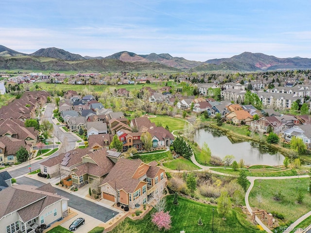 bird's eye view featuring a residential view and a water and mountain view