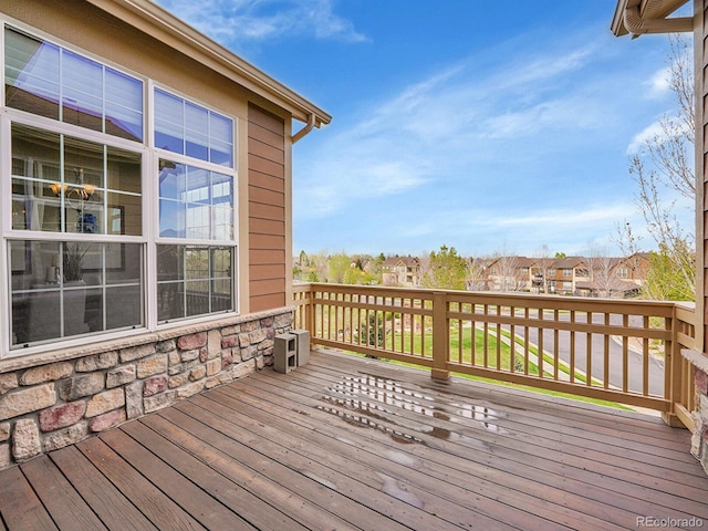 wooden terrace with a residential view