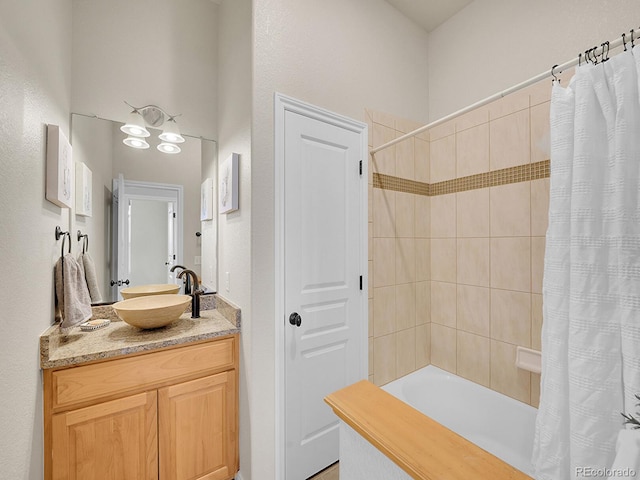 full bathroom featuring vanity and shower / tub combo with curtain