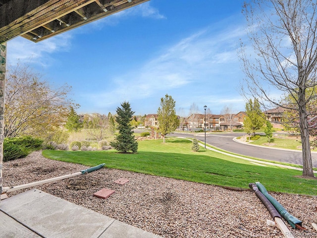 view of yard featuring a residential view