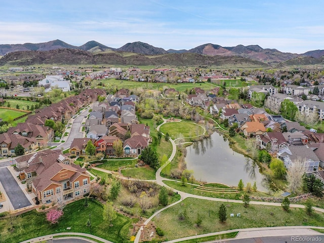 birds eye view of property featuring a residential view and a water and mountain view