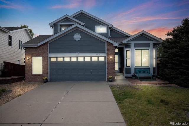 16839 Trail View Cir, Parker, CO 80134 - view of front facade featuring brick siding, concrete driveway, a garage, and a lawn