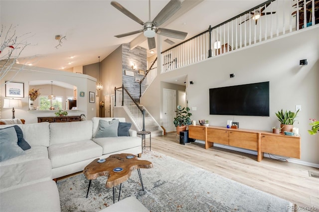 16839 Trail View Cir, Parker, CO 80134 - living area featuring high vaulted ceiling, wood finished floors, stairs, ceiling fan, and baseboards