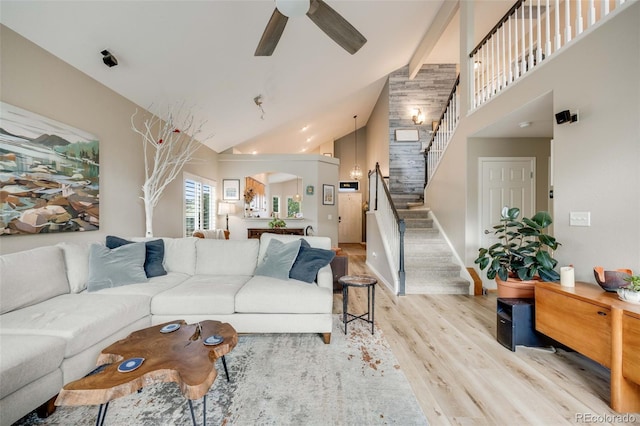 16839 Trail View Cir, Parker, CO 80134 - living room with light wood-style flooring, a ceiling fan, stairway, and high vaulted ceiling