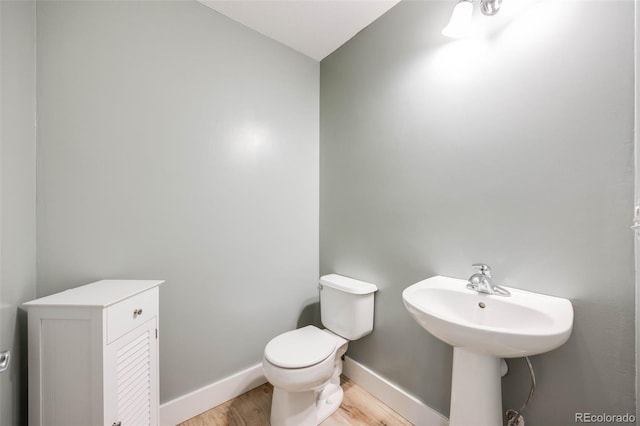16839 Trail View Cir, Parker, CO 80134 - bathroom featuring wood finished floors, toilet, and baseboards