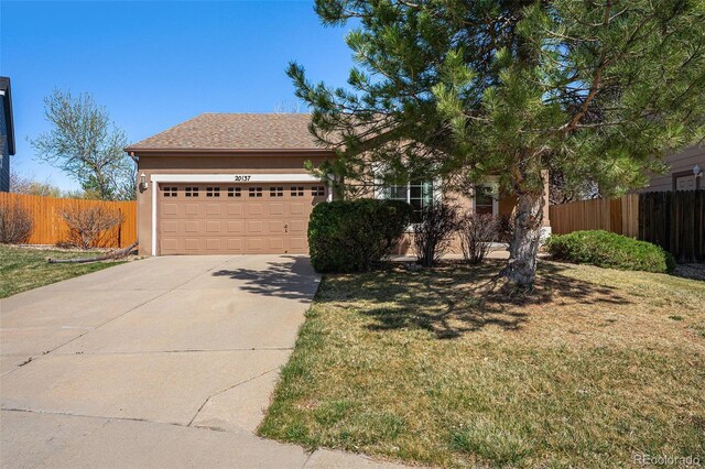 20137 E Prentice Pl, Centennial, CO 80015 - obstructed view of property with fence, a garage, stucco siding, a front yard, and driveway