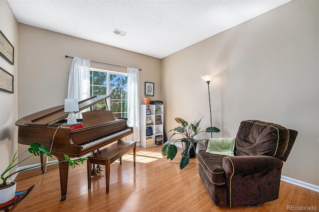 20137 E Prentice Pl, Centennial, CO 80015 - sitting room with baseboards, a textured ceiling, light wood-style flooring, and visible vents