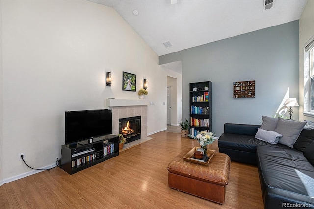 20137 E Prentice Pl, Centennial, CO 80015 - living area featuring visible vents, baseboards, wood finished floors, and a fireplace