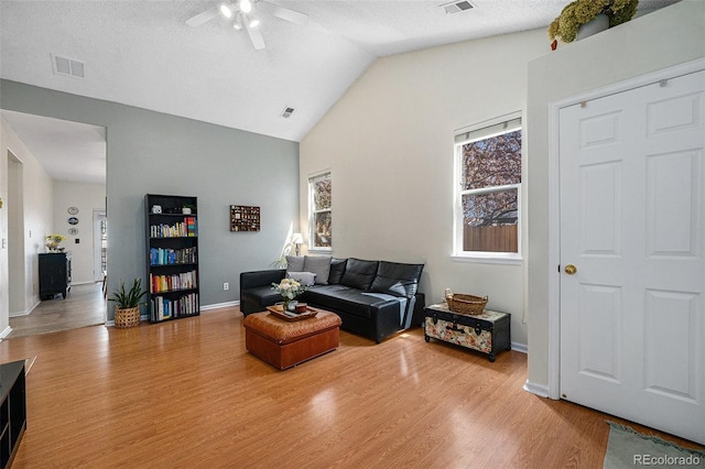 20137 E Prentice Pl, Centennial, CO 80015 - living room featuring a ceiling fan, baseboards, wood finished floors, vaulted ceiling, and visible vents
