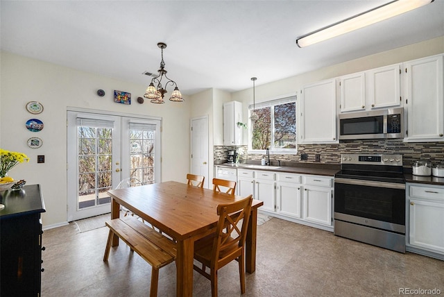 20137 E Prentice Pl, Centennial, CO 80015 - dining room with an inviting chandelier, french doors, and visible vents