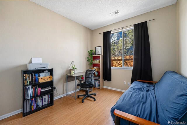 20137 E Prentice Pl, Centennial, CO 80015 - bedroom with visible vents, a textured ceiling, baseboards, and wood finished floors