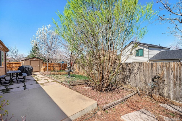 20137 E Prentice Pl, Centennial, CO 80015 - view of yard with an outdoor structure, a fenced backyard, a patio area, and a storage shed
