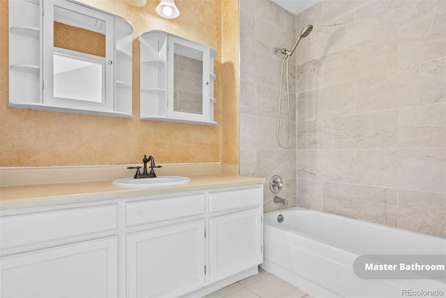 bathroom with vanity, tile patterned floors, and tiled shower / bath combo