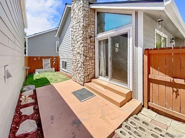 doorway to property with a patio