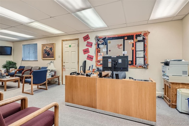 office featuring light colored carpet and a paneled ceiling