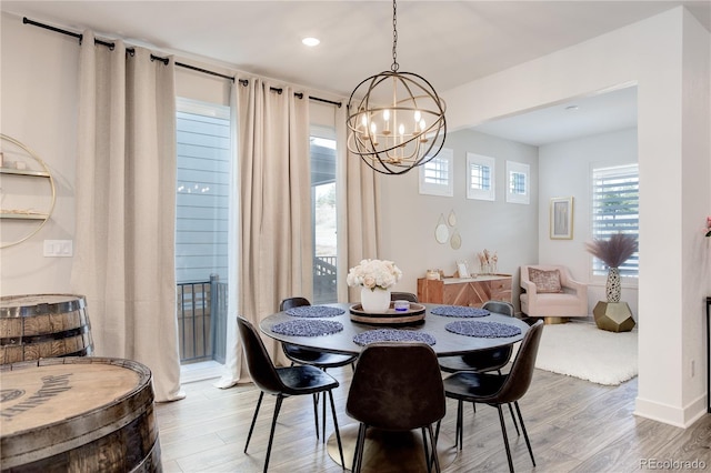 431 Courtfield Way, Castle Pines, CO 80108 - dining space featuring a chandelier, wood finished floors, and recessed lighting