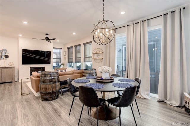 431 Courtfield Way, Castle Pines, CO 80108 - dining space with light wood finished floors, a chandelier, ceiling fan, and recessed lighting