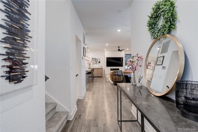 431 Courtfield Way, Castle Pines, CO 80108 - hall featuring wood finished floors and recessed lighting