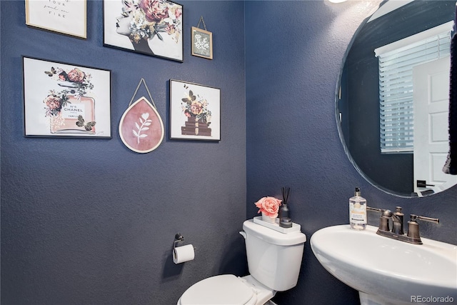 431 Courtfield Way, Castle Pines, CO 80108 - half bathroom with a sink and toilet