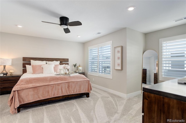 431 Courtfield Way, Castle Pines, CO 80108 - bedroom with light colored carpet, arched walkways, ceiling fan, and recessed lighting