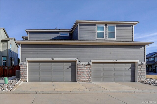 431 Courtfield Way, Castle Pines, CO 80108 - traditional-style home featuring brick siding, a garage, and driveway