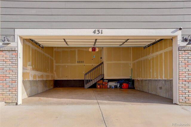 431 Courtfield Way, Castle Pines, CO 80108 - garage with a garage door opener and concrete driveway