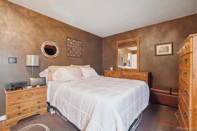 carpeted bedroom featuring a textured ceiling