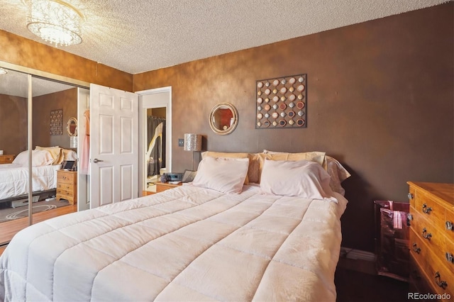 bedroom featuring a closet and a textured ceiling