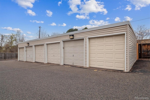 garage with fence
