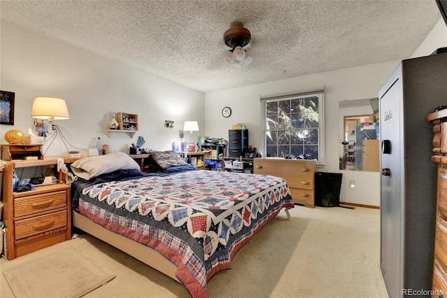 bedroom with a textured ceiling, vaulted ceiling, and carpet