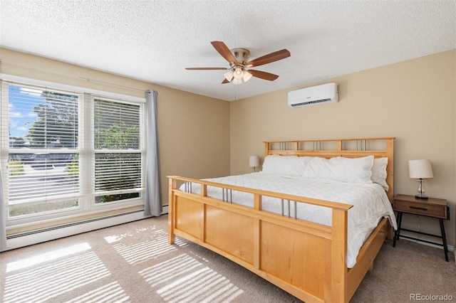 1246 S Telluride St, Aurora, CO 80017 - bedroom featuring a baseboard radiator, a wall mounted air conditioner, light carpet, a textured ceiling, and a ceiling fan