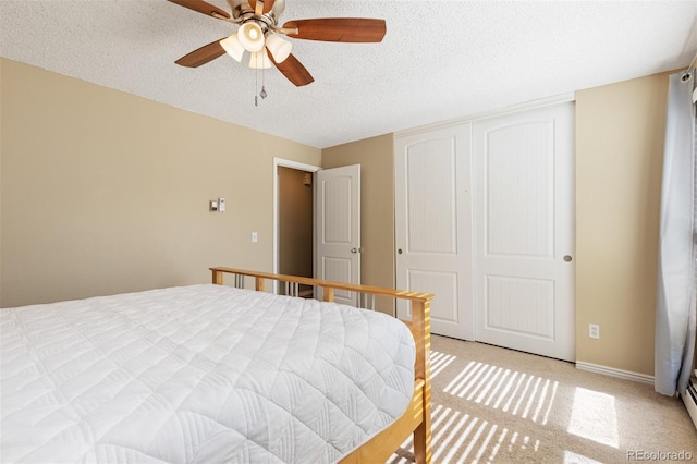 1246 S Telluride St, Aurora, CO 80017 - bedroom featuring a textured ceiling, a closet, light carpet, and a ceiling fan
