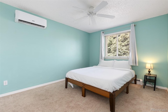 1246 S Telluride St, Aurora, CO 80017 - bedroom with a wall mounted AC, light carpet, baseboard heating, a textured ceiling, and ceiling fan