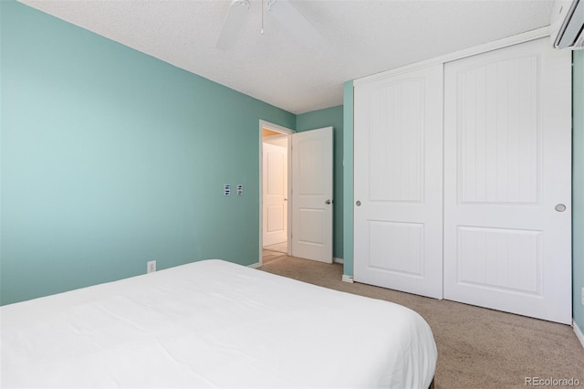 1246 S Telluride St, Aurora, CO 80017 - carpeted bedroom featuring a wall unit AC, a closet, and ceiling fan