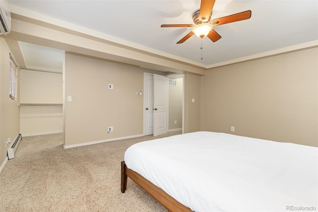 1246 S Telluride St, Aurora, CO 80017 - bedroom with baseboard heating, a wall mounted AC, carpet flooring, ceiling fan, and a walk in closet