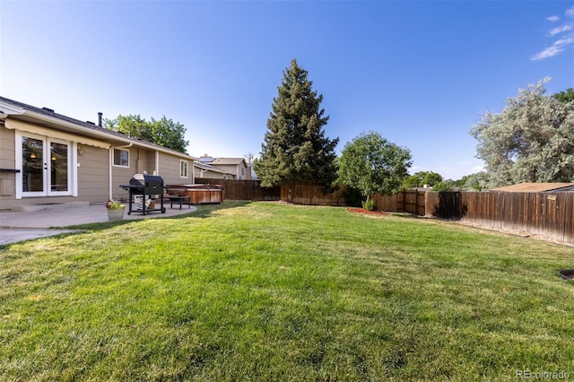 1246 S Telluride St, Aurora, CO 80017 - fenced backyard with a patio and a hot tub