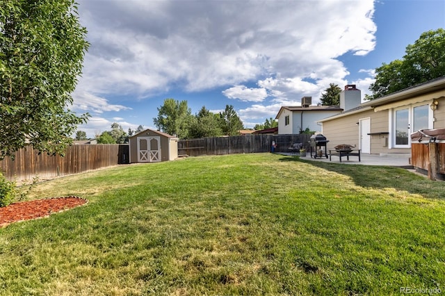 1246 S Telluride St, Aurora, CO 80017 - fenced backyard featuring a shed and a patio
