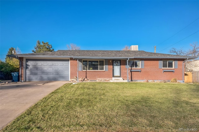 ranch-style home with a front yard and a garage