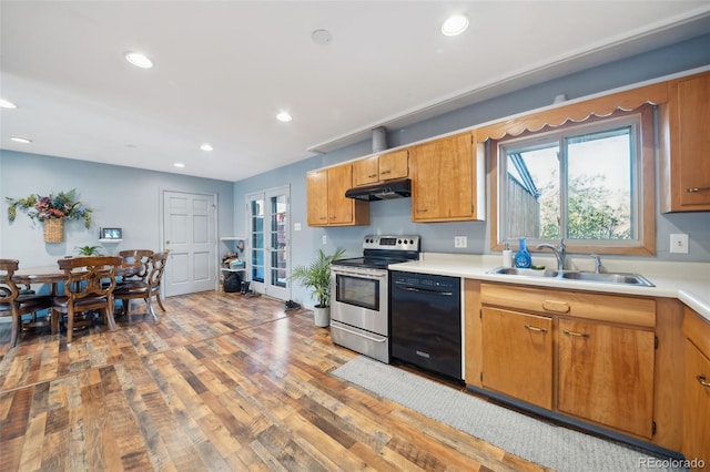 kitchen with dishwasher, light wood-type flooring, stainless steel electric stove, and sink